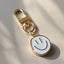 white smiley face keychain