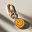 orange smiley face keychain