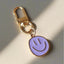 purple smiley face keychain