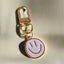 light pink smiley face keychain